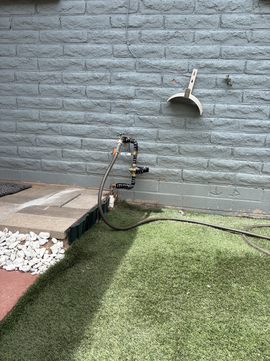 Exterior water-service piping serving a Southern Arizona property