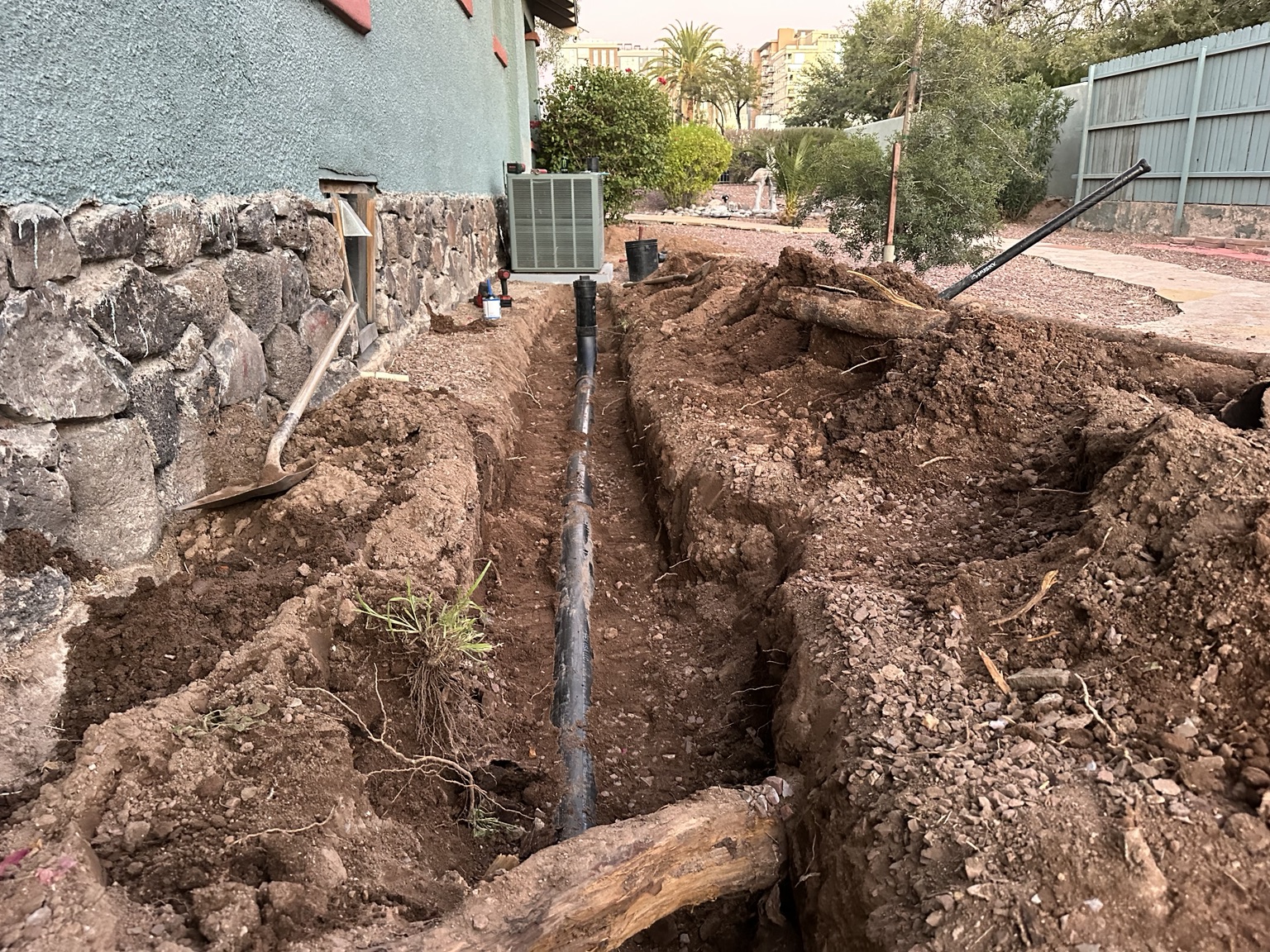 Underground sewer line replacement installed beside a Tucson property