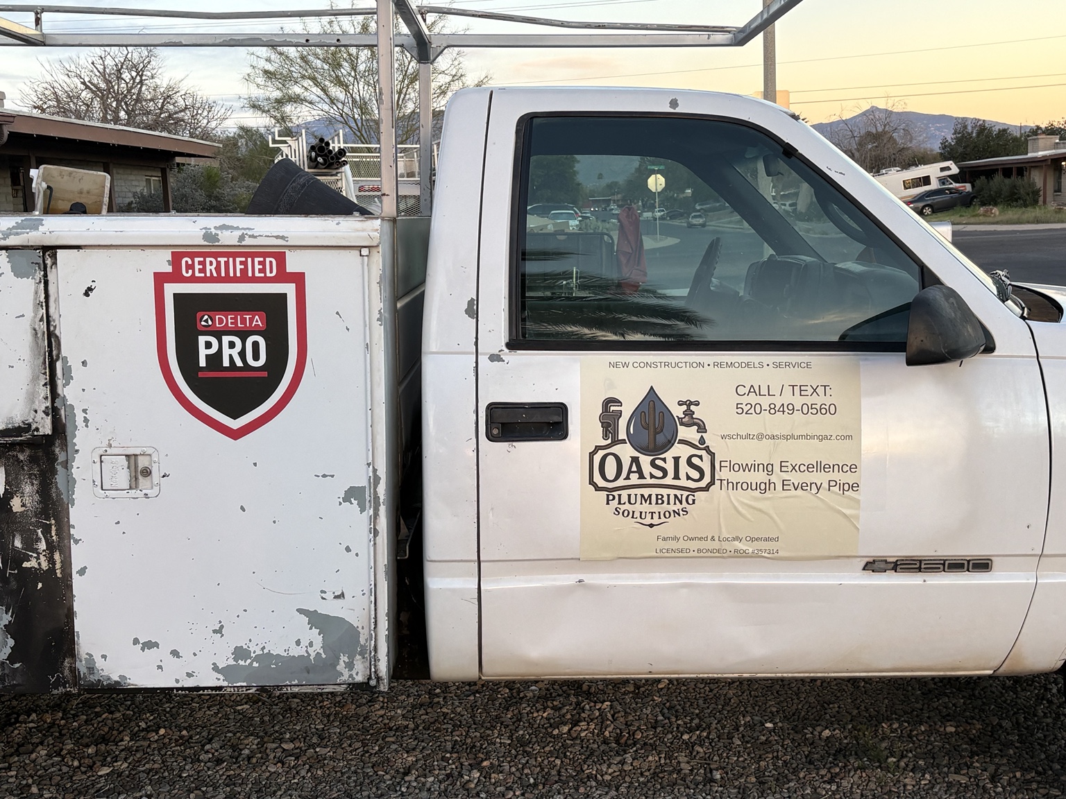 Oasis Plumbing Solutions branded service truck in Tucson