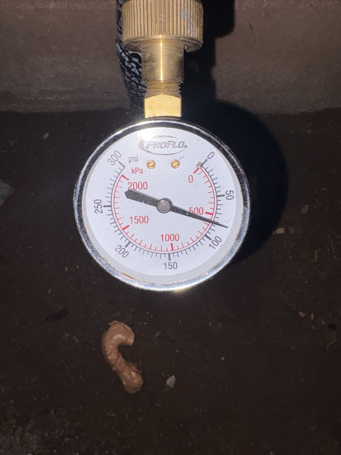 Water pressure gauge used during plumbing leak and pressure investigation