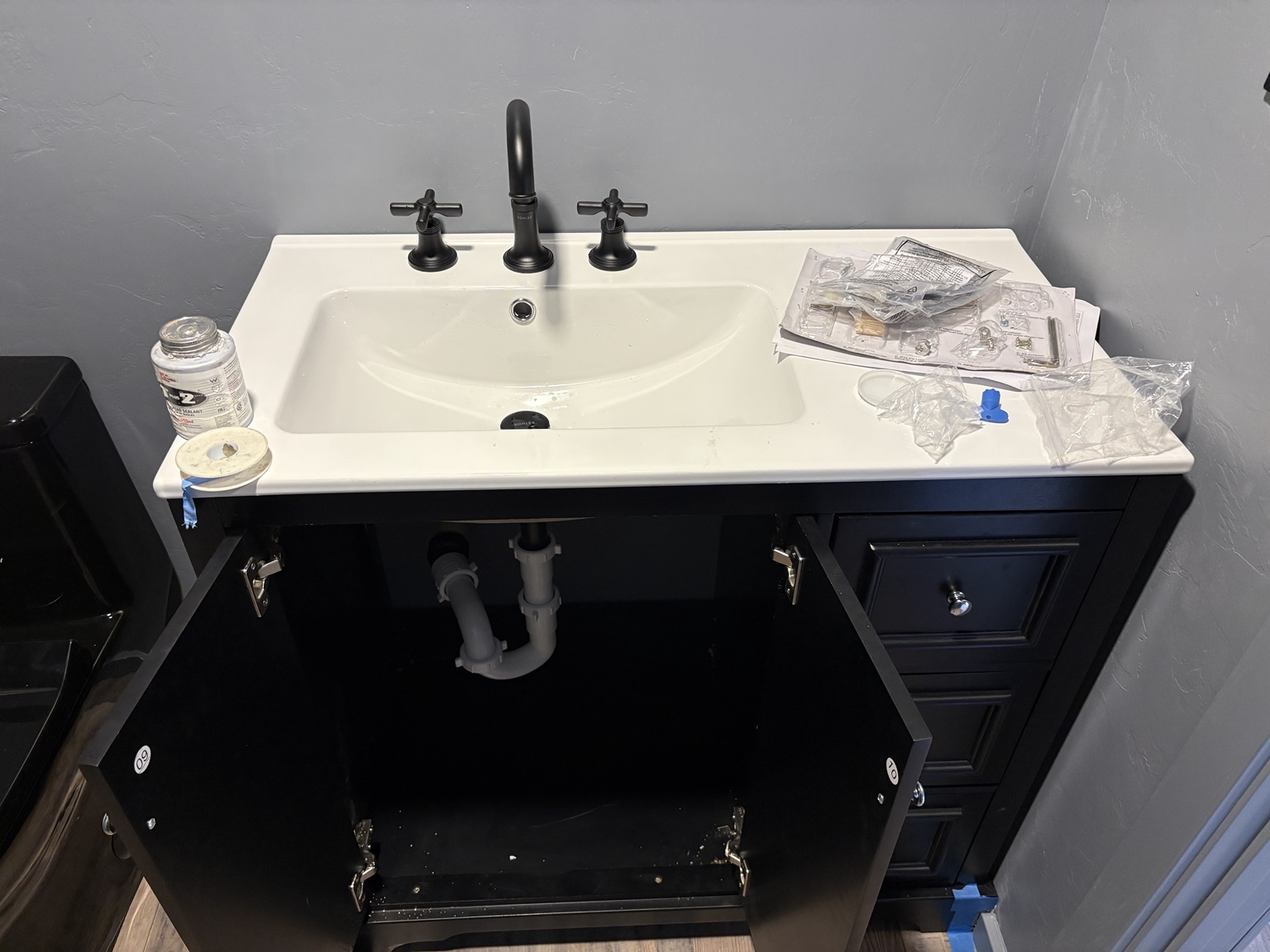 Bathroom sink plumbing installation in progress